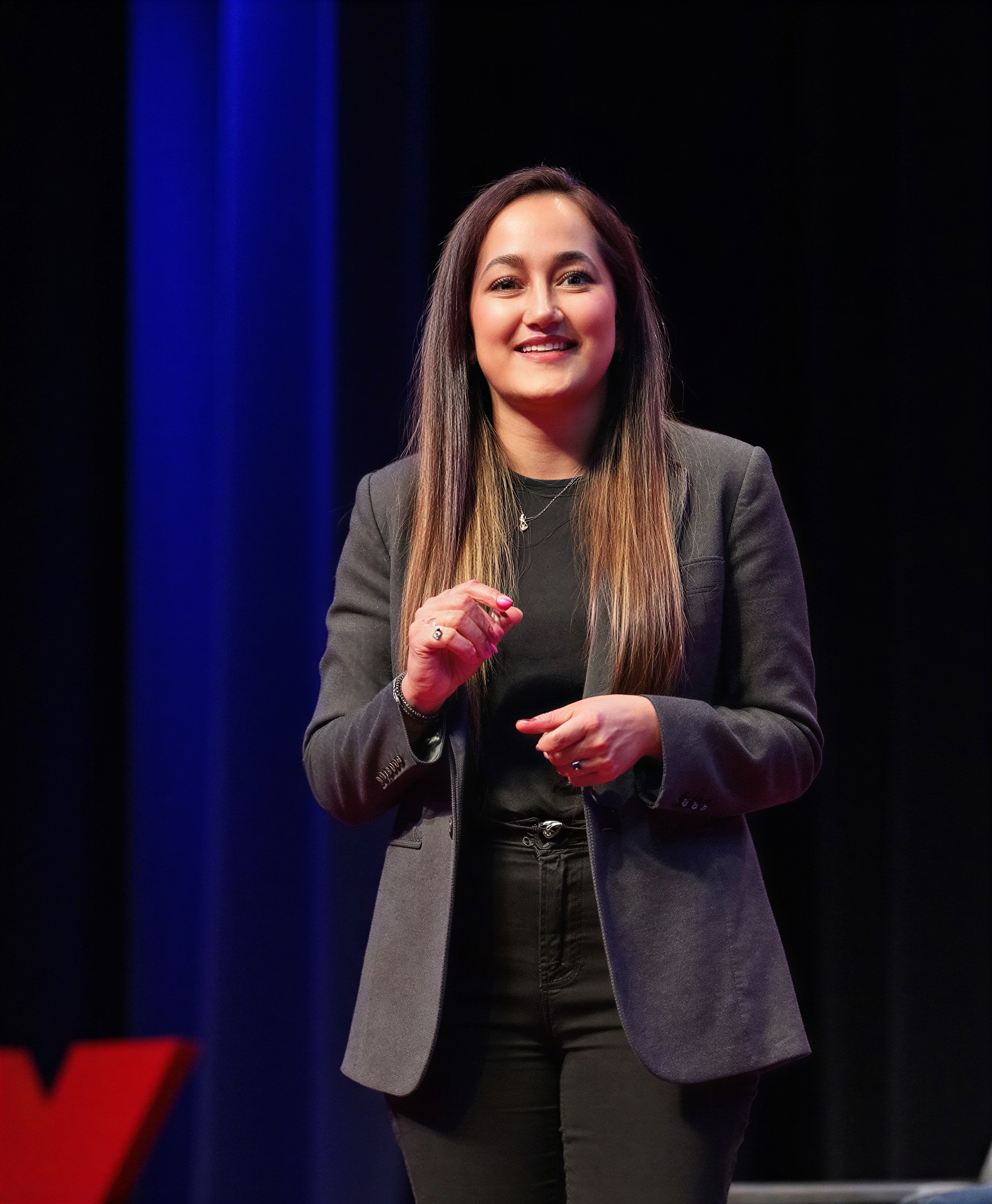 Gita Poudel speaking at TEDx